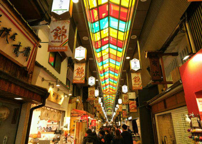 The multi-colored ceiling of Nishiki Market, the go-to street food spot in Kyoto.